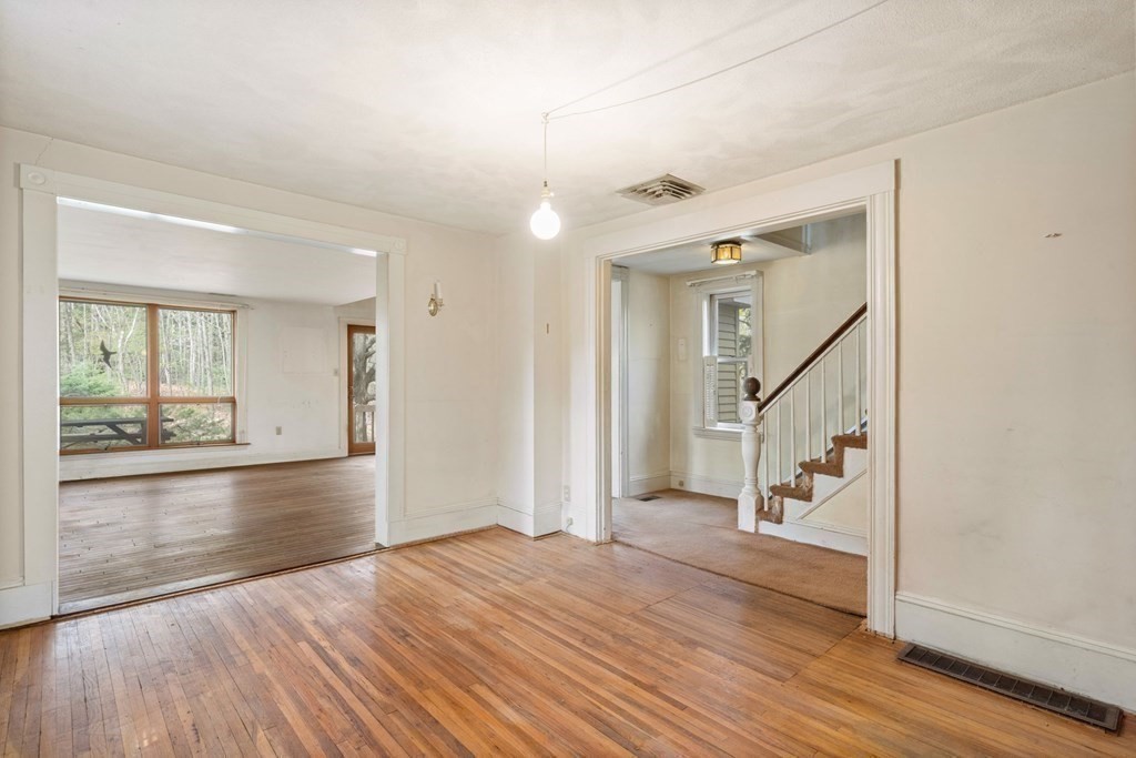 21 Columbus Street Lexington, MA 02421 - Photo 11 of 26 a view of empty room with wooden floor and fan