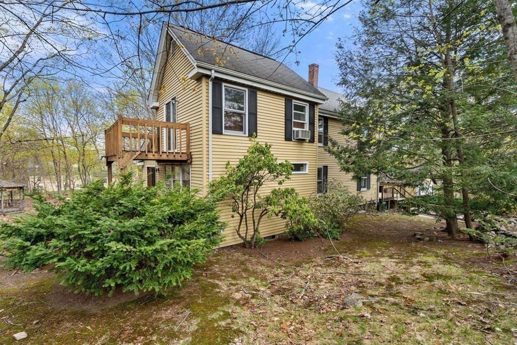 21 Columbus Street Lexington, MA 02421 - Photo 25 of 26 a front view of a house with garden