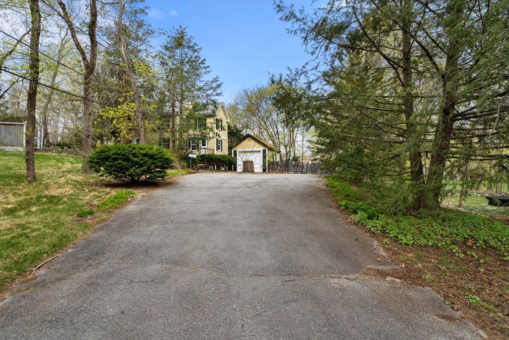 21 Columbus Street Lexington, MA 02421 - Photo 26 of 26 a view of a house with a yard and basketball court