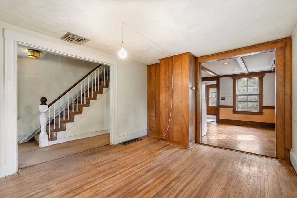 21 Columbus Street Lexington, MA 02421 - Photo 8 of 26 a view of an entryway with wooden floor and door