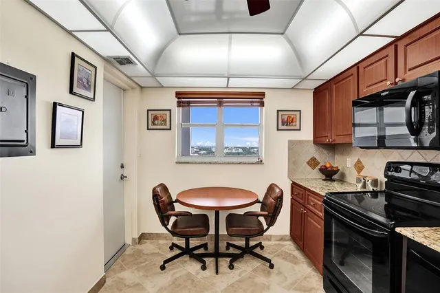 a bedroom with a bed furniture and a large window
