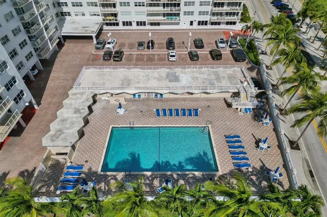 a view of swimming pool with outdoor seating