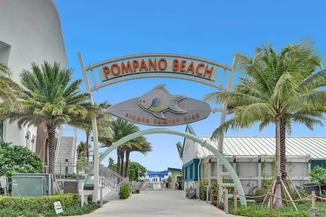 a patio with swimming pool table and chairs
