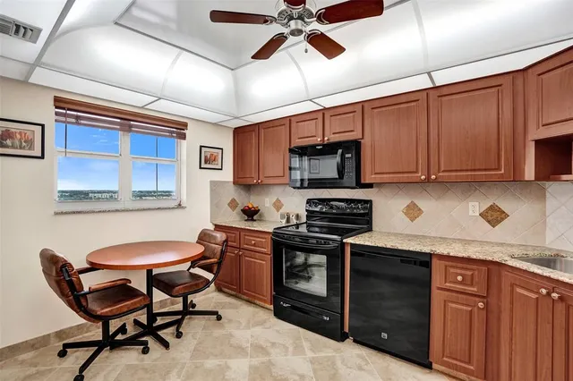 a bedroom with bed and a flat screen tv