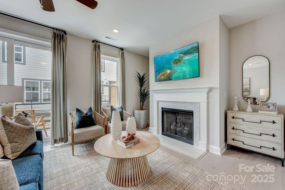 729 Hoke Lane Davidson, NC 28036 - Photo 11 of 29 a living room with furniture and a fireplace