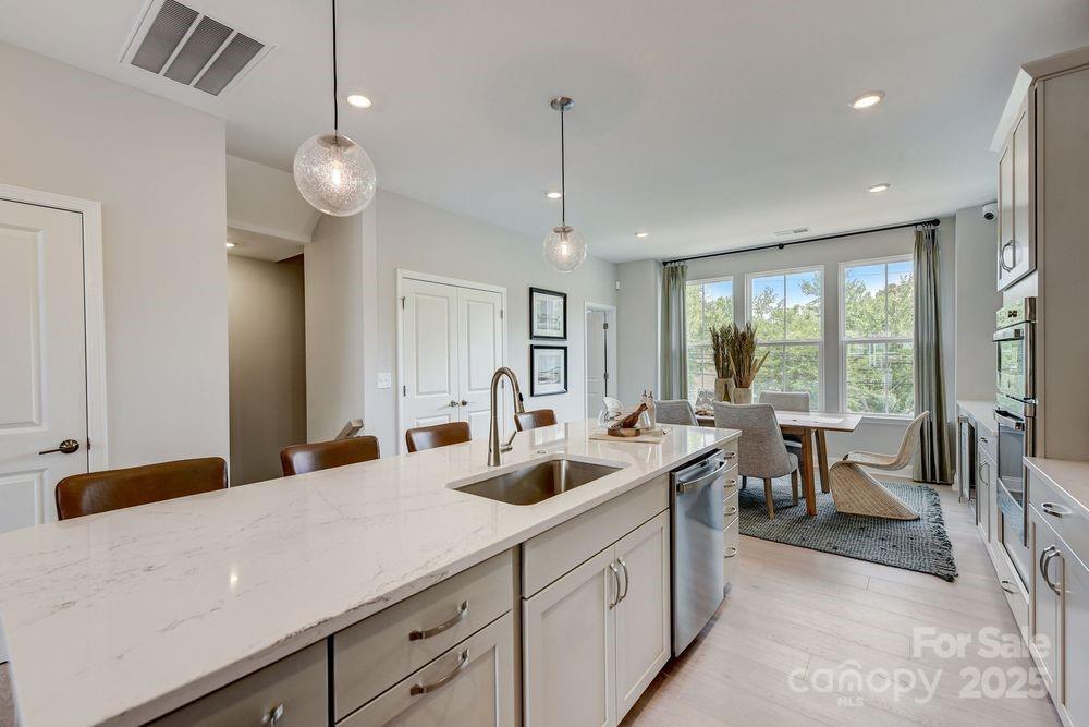729 Hoke Lane Davidson, NC 28036 - Photo 9 of 29 a kitchen with lots of counter space and windows