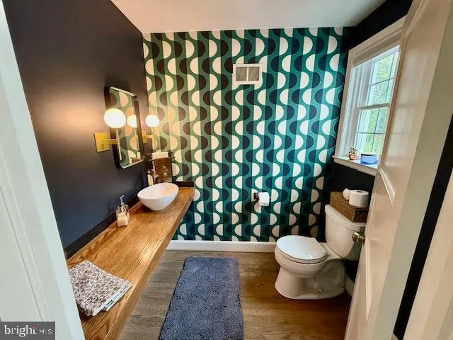 a bathroom with a sink and glass door