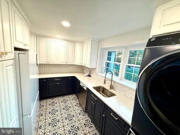 a bedroom with a bed and dresser