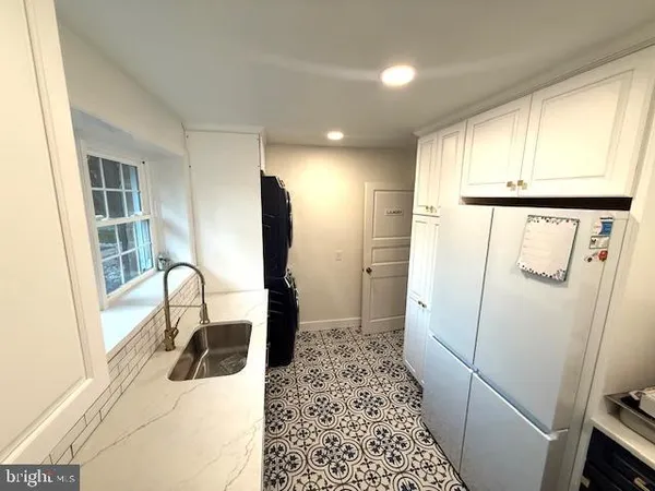a view of livingroom with furniture and staircase