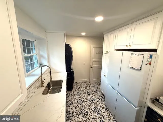 a view of livingroom with furniture and staircase