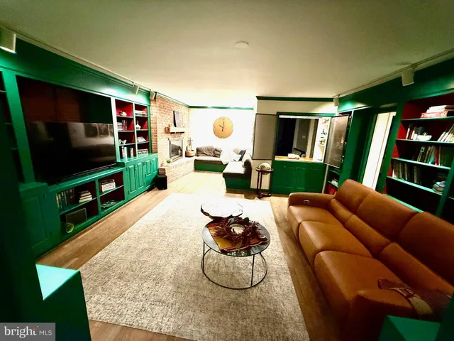 a spacious bedroom with a bed and large windows