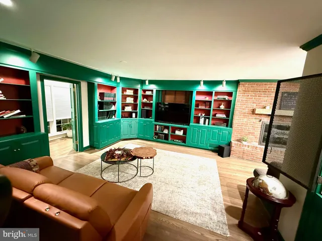a bathroom with a large tub a sink and a window