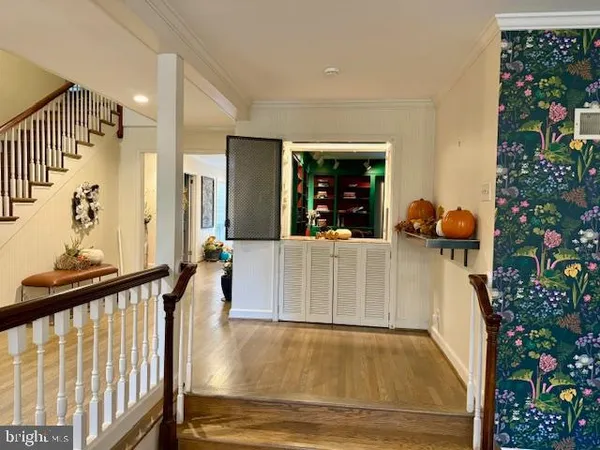 a kitchen with granite countertop a refrigerator a sink a stove and island