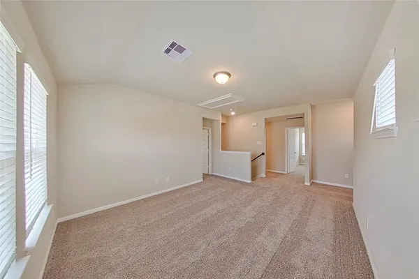 a view of an empty room with a window