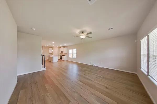 an aerial view of a house with swimming pool and mountains