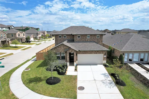 a view of a house with backyard fire pit and outdoor seating