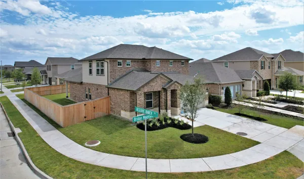 a view of a house with backyard and porch
