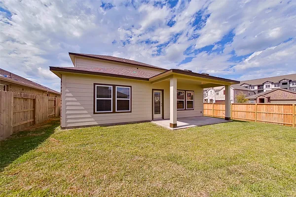 an aerial view of a house with a swimming pool