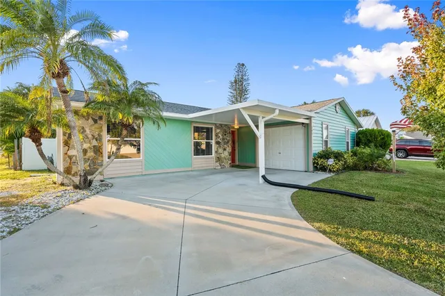 a view of a house with a yard and plants