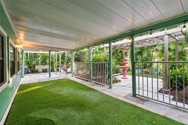 a view of a backyard with a large tree