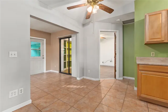 a view of a kitchen with a sink and a refrigerator cabinets