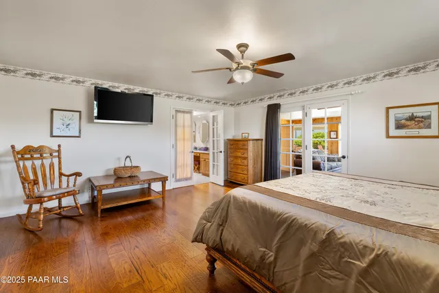 a bedroom with a bed furniture and a window