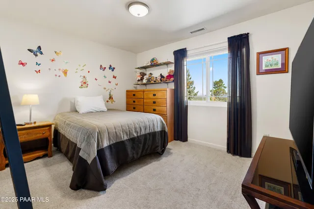 a kitchen with stainless steel appliances a stove a microwave and a refrigerator