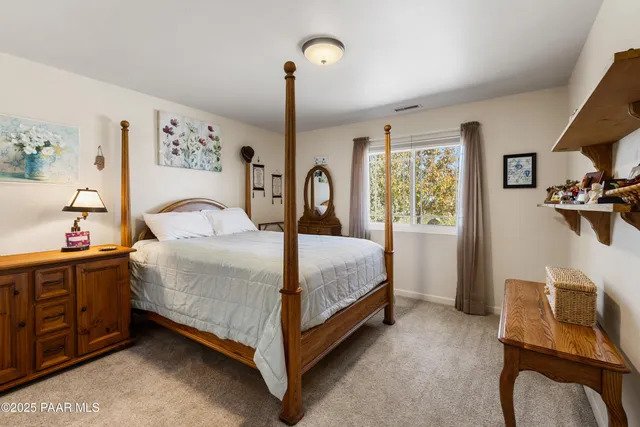 a building outdoor space with patio furniture and garden