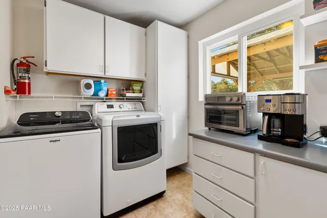 a view of a patio with a table and chairs