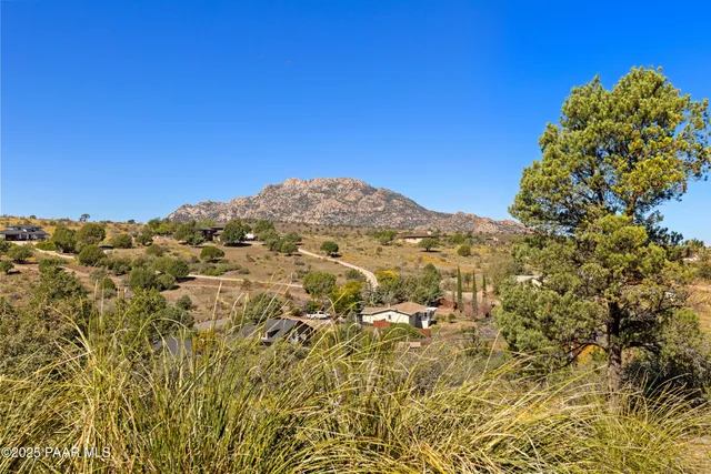 an aerial view of house with a yard