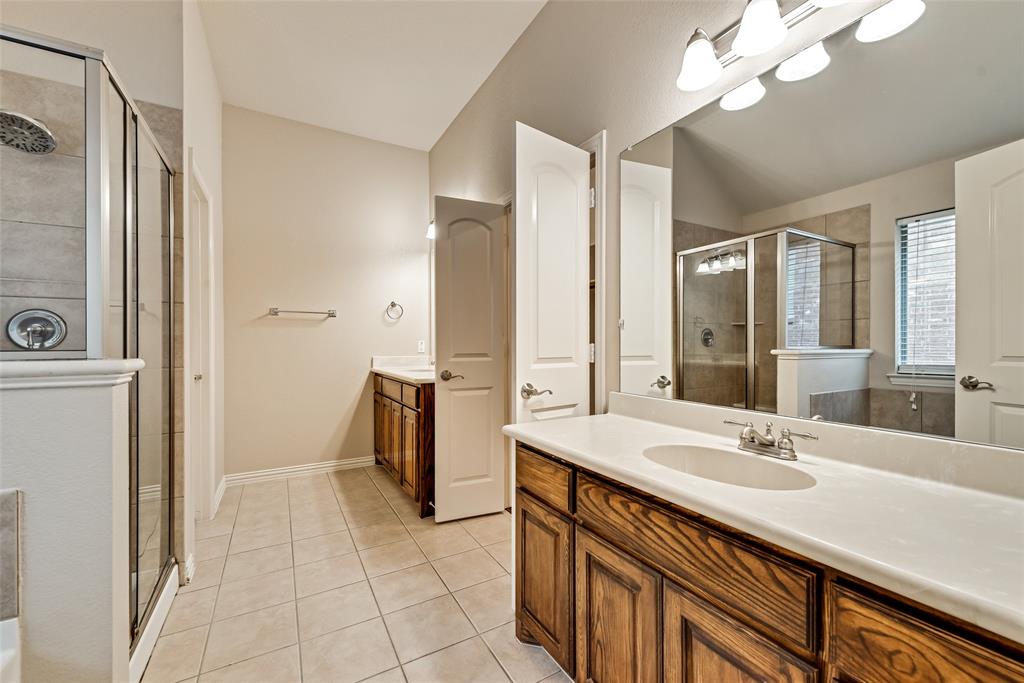 204 Dancing Light Lane Red Oak, TX 75154 - Photo 13 of 21 a spacious bathroom with a sink double vanity and a mirror