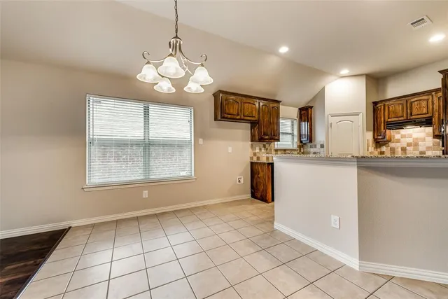 a view of a kitchen with a sink cabinets and window