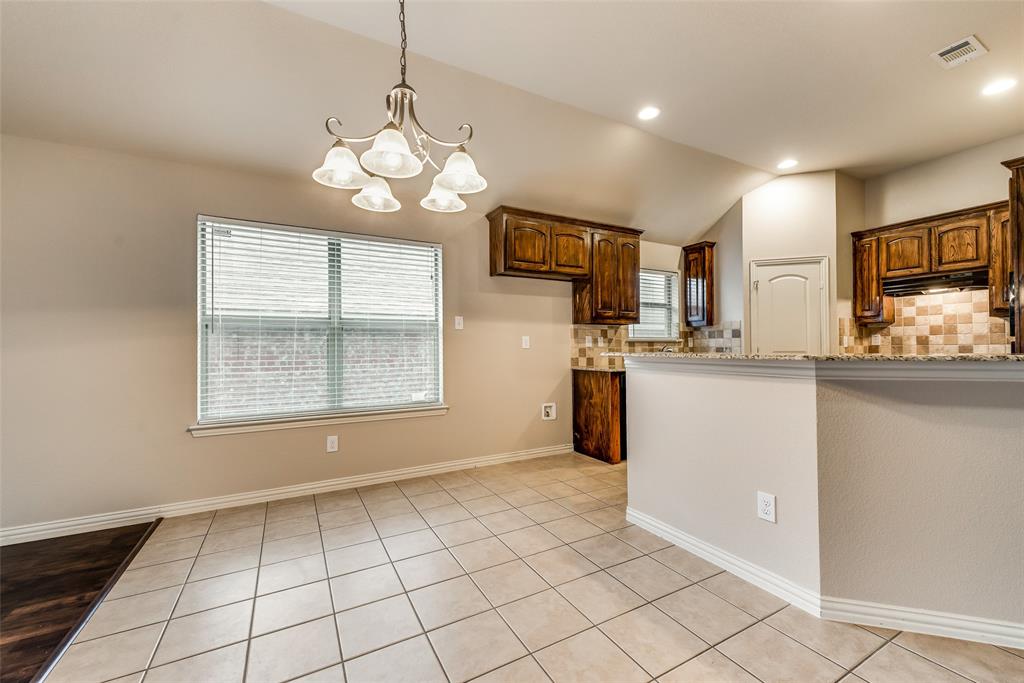 204 Dancing Light Lane Red Oak, TX 75154 - Photo 9 of 21 a view of a kitchen with a sink cabinets and window
