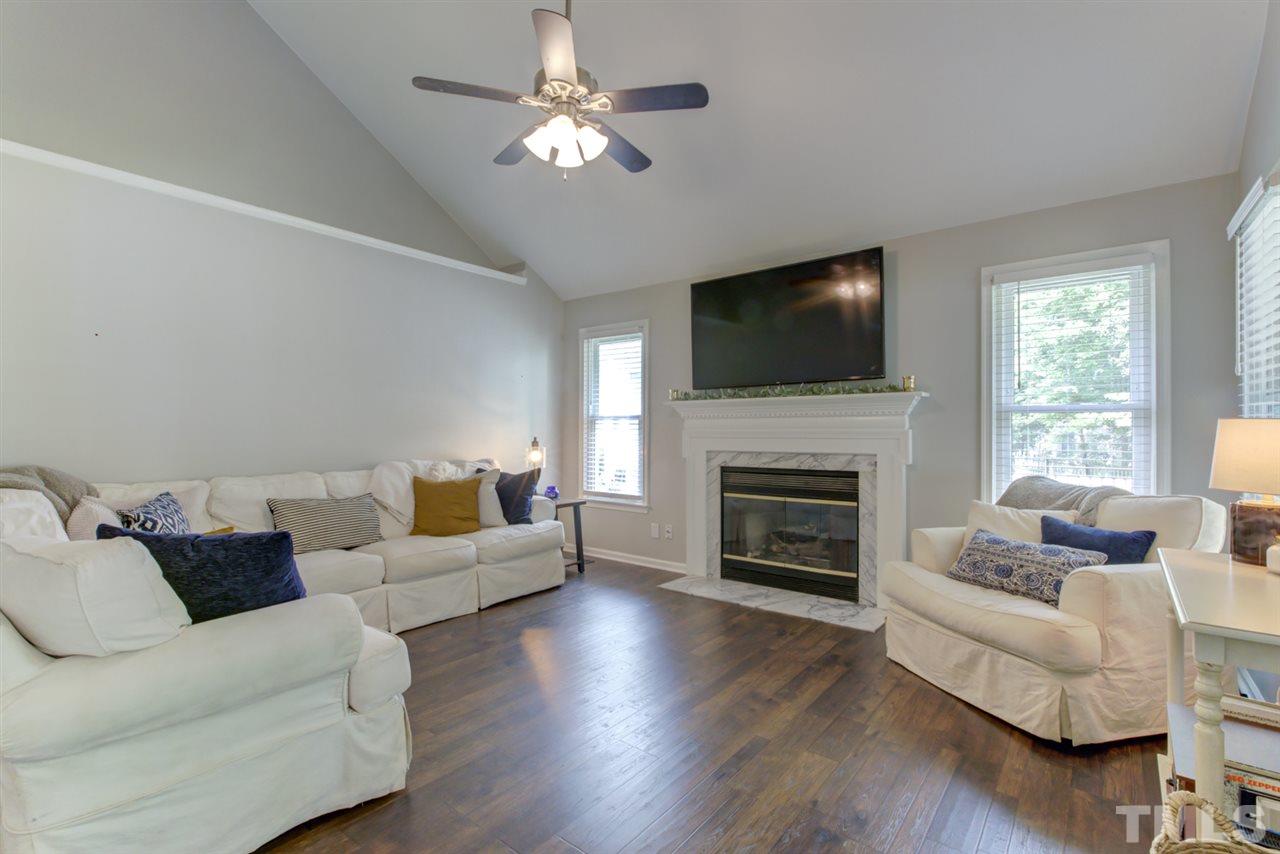 5516 Banwell Place Raleigh, NC 27613 - Photo 11 of 30 Airy Family Room with 2-story vaulted ceiling includes fireplace