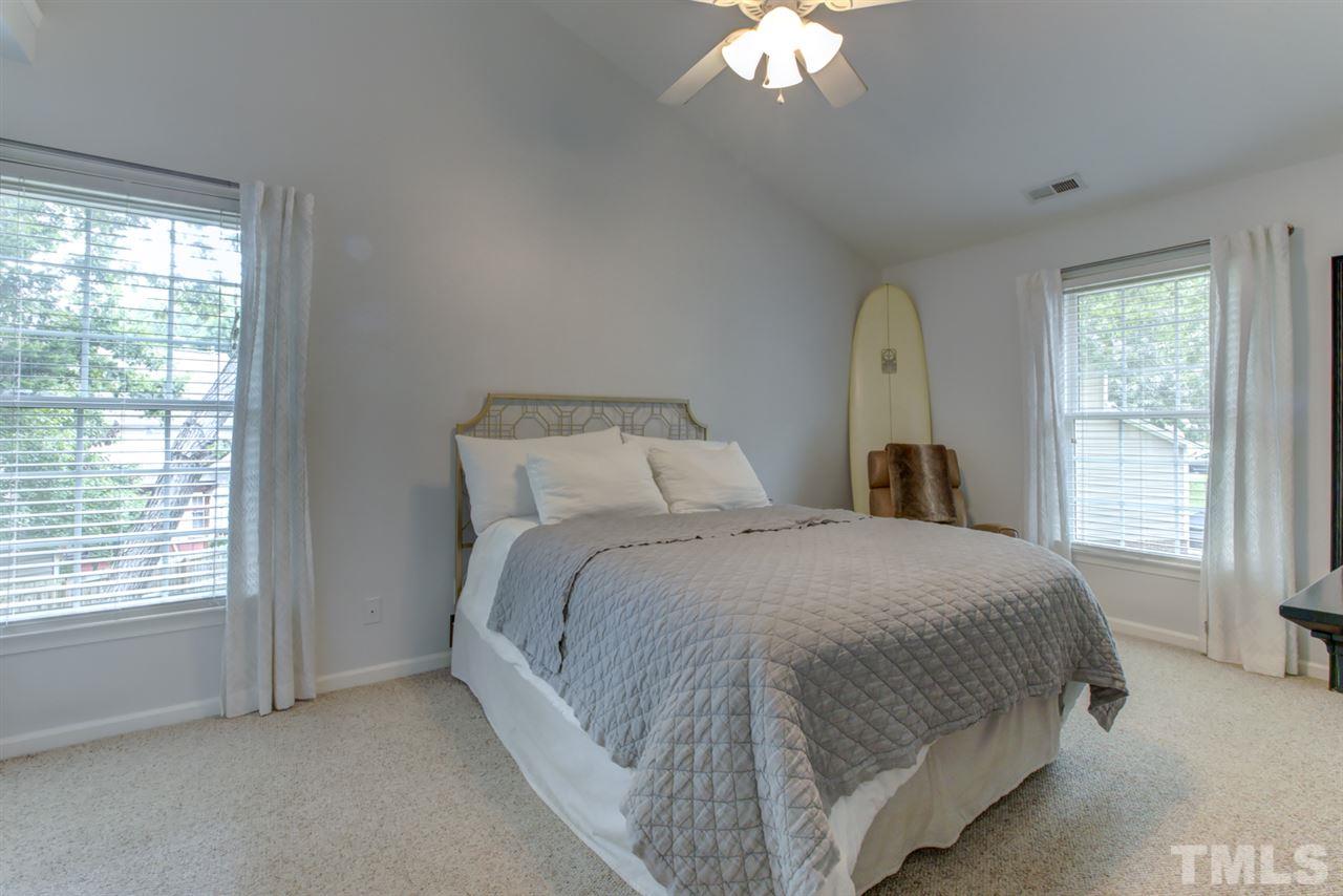 5516 Banwell Place Raleigh, NC 27613 - Photo 18 of 30 Master bedroom with vaulted ceiling and walk in closet