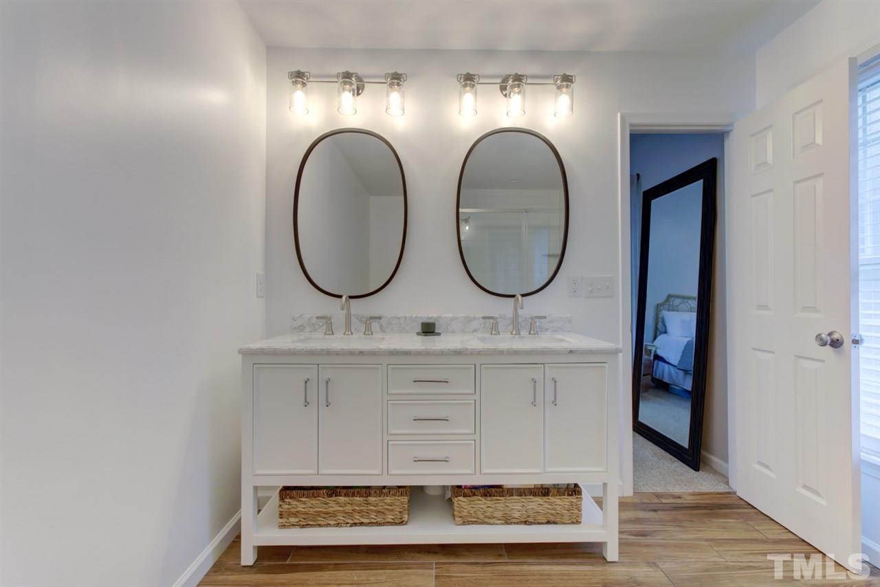 5516 Banwell Place Raleigh, NC 27613 - Photo 19 of 30 Renovated master bathroom includes beautiful double vanity