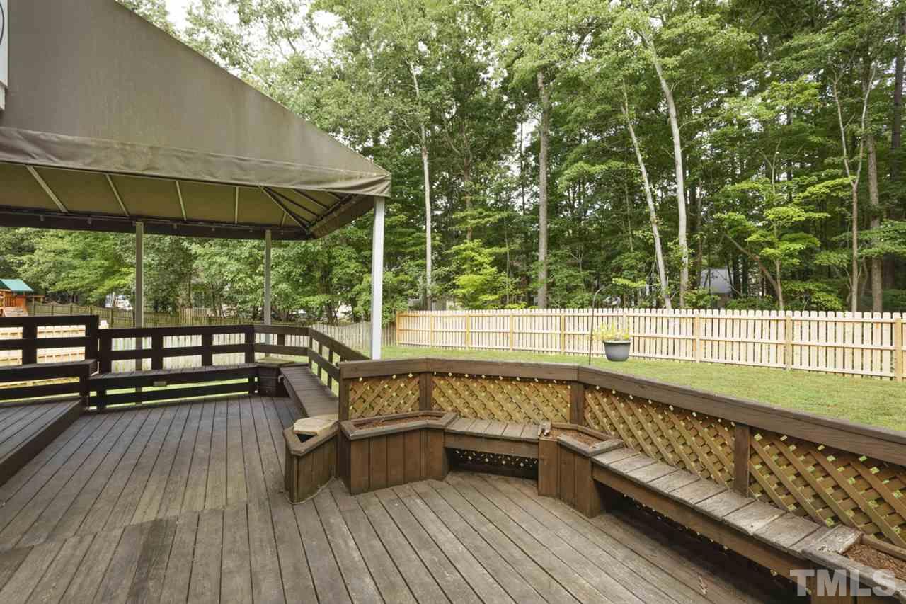 5516 Banwell Place Raleigh, NC 27613 - Photo 26 of 30 Another view of both decks with built in bench seating - notice private rear view and new fence!