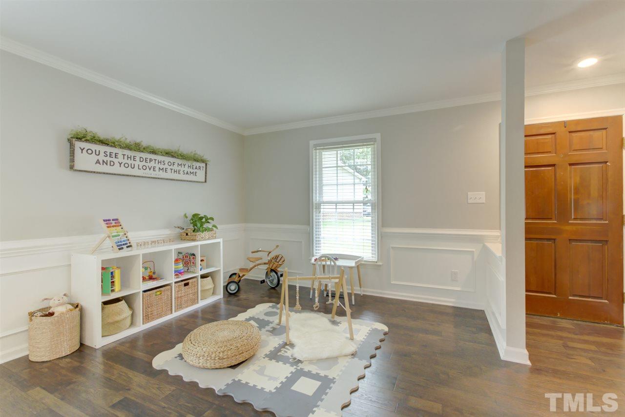 5516 Banwell Place Raleigh, NC 27613 - Photo 4 of 30 Open Living Room area full of possibilities for uses! Notice lovely molding.