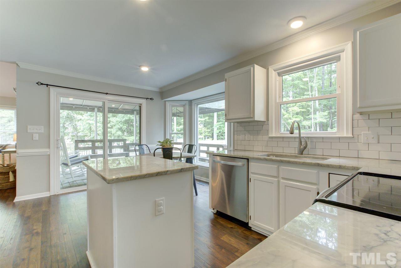 5516 Banwell Place Raleigh, NC 27613 - Photo 7 of 30 Gorgeous remodeled kitchen with new quartzite countertops