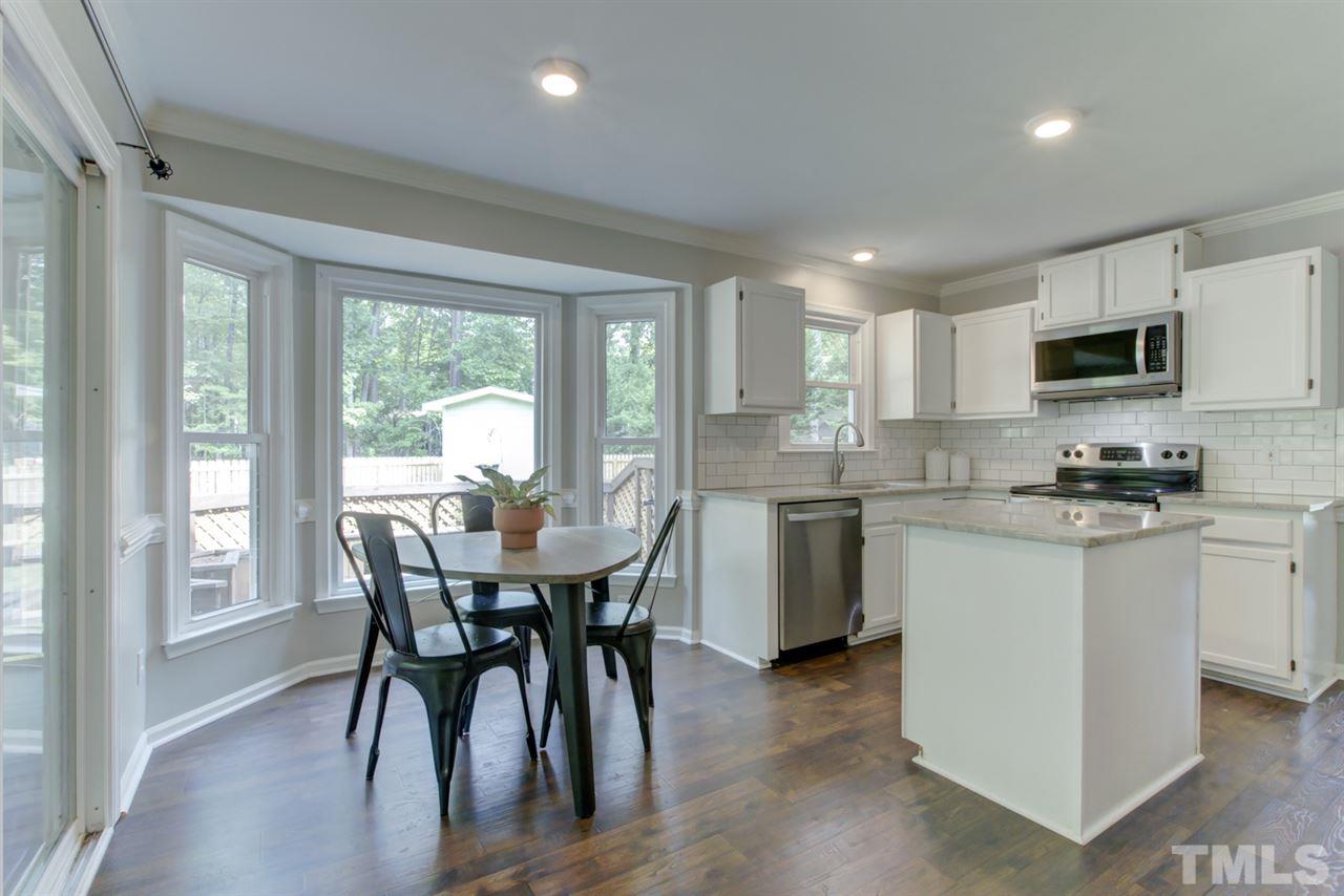 5516 Banwell Place Raleigh, NC 27613 - Photo 9 of 30 Kitchen area also has center island and breakfast nook area