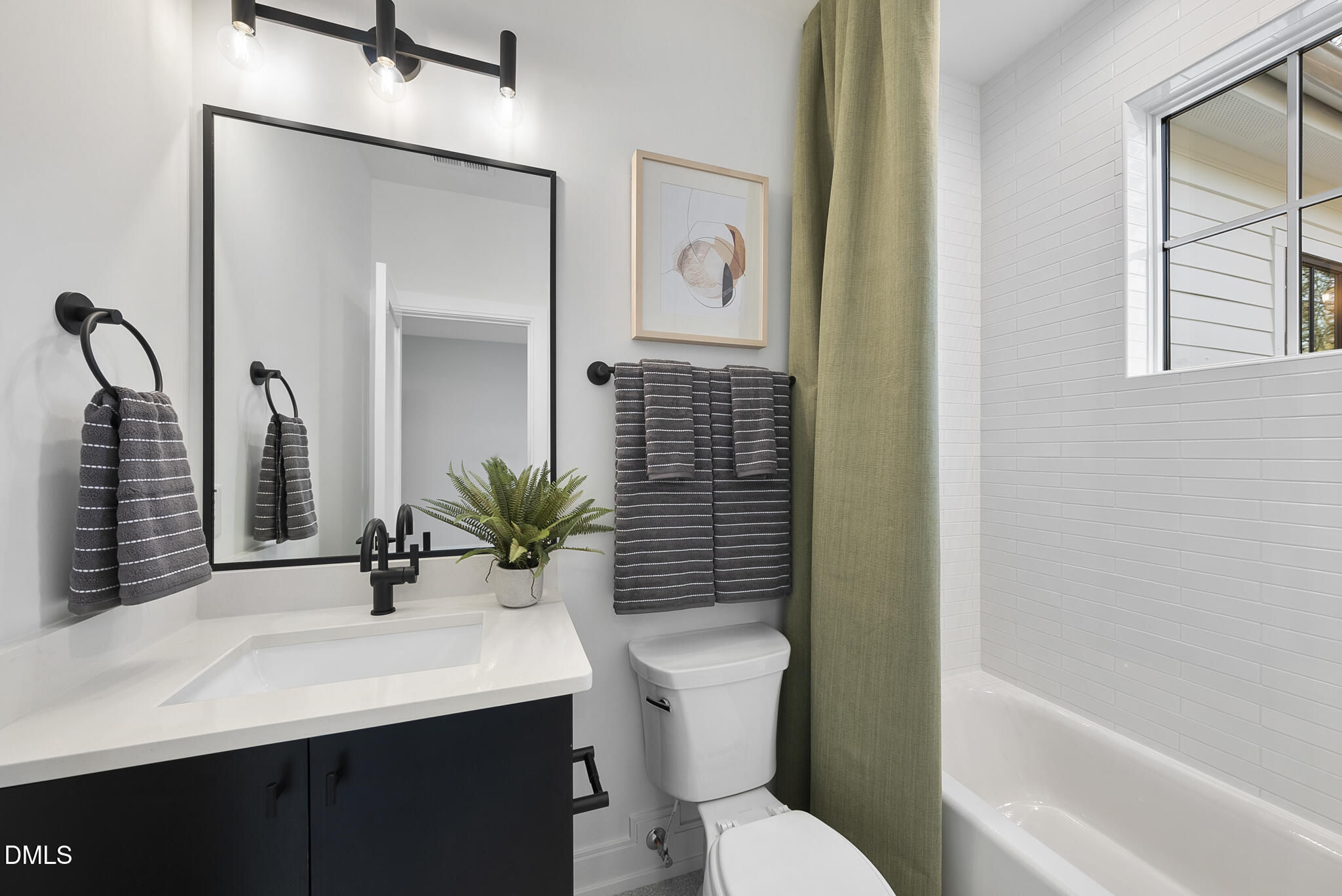 3416 Makers Circle Raleigh, NC 27612 - Photo 36 of 41 a bathroom with a sink toilet and shower