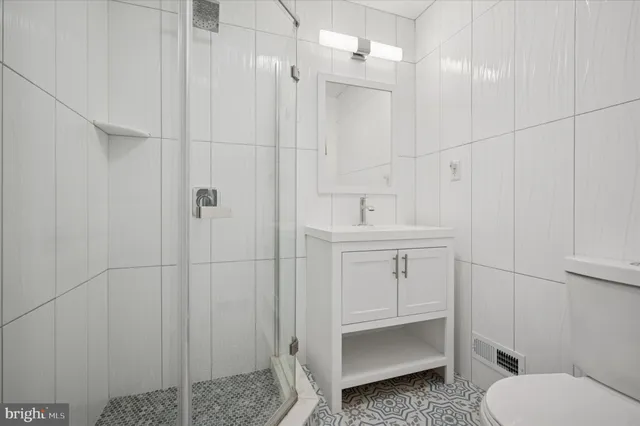 a bathroom with a sink toilet and vanity