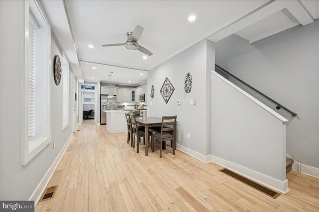 a view of a dining room with furniture and wooden floor