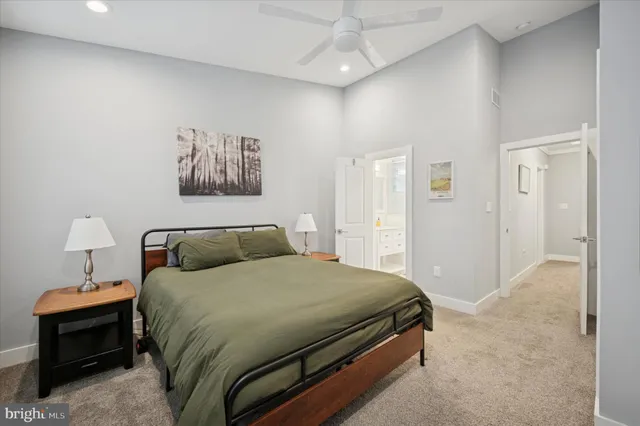 a bedroom with a bed and a view of bathroom