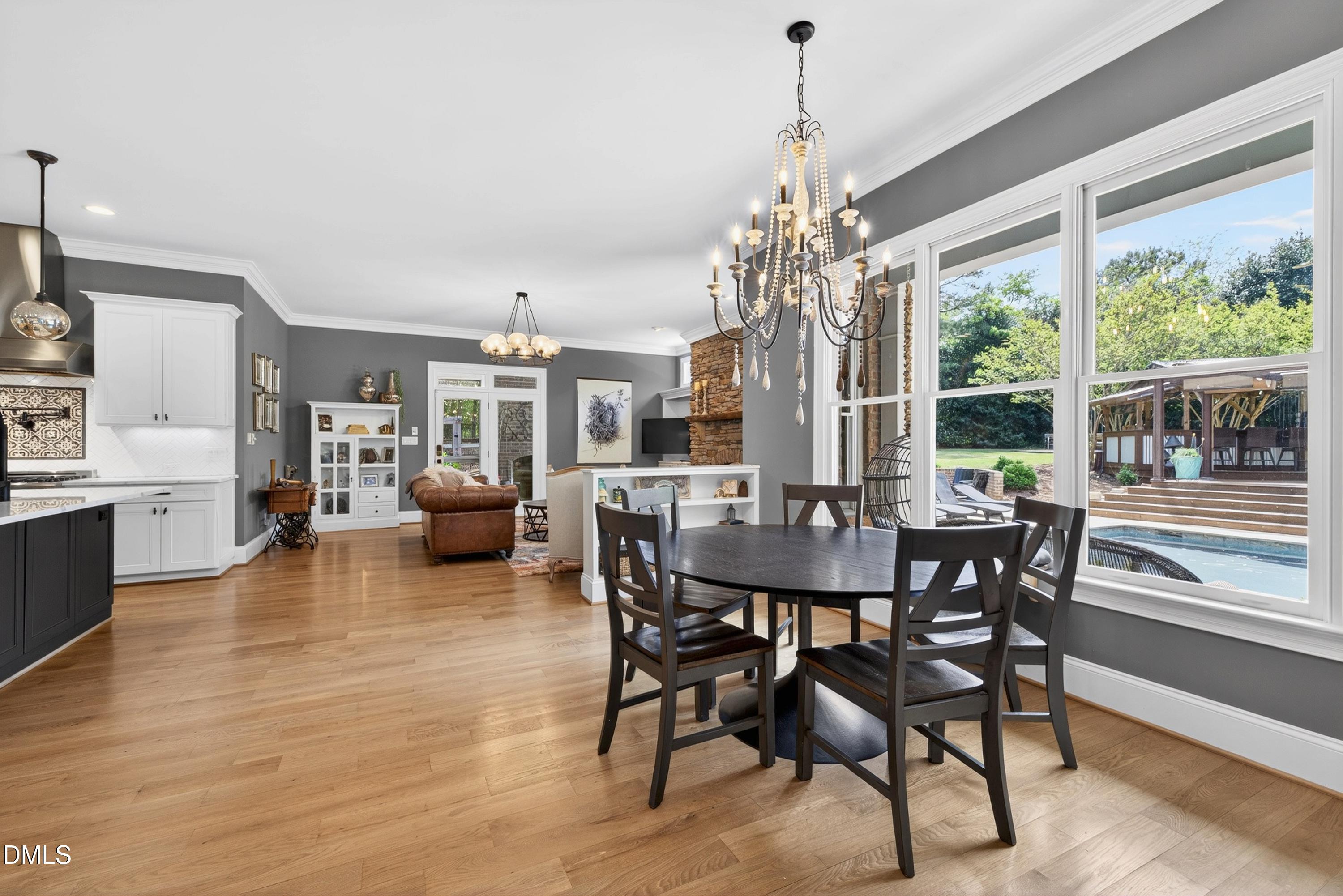 3513 Eilla Bluffs Court Raleigh, NC 27606 - Photo 26 of 86 a view of a dining room with furniture window and outside view