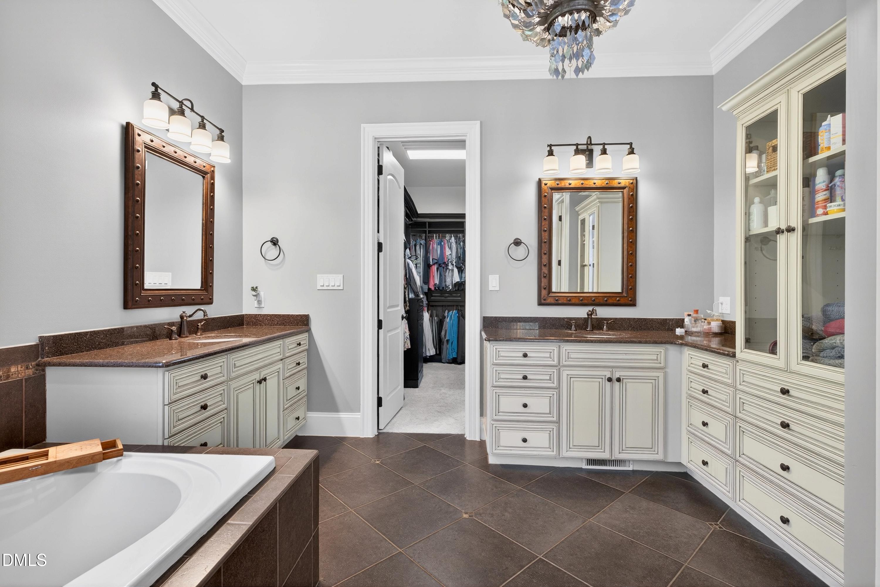 3513 Eilla Bluffs Court Raleigh, NC 27606 - Photo 35 of 86 a spacious bathroom with a granite countertop sink double vanity