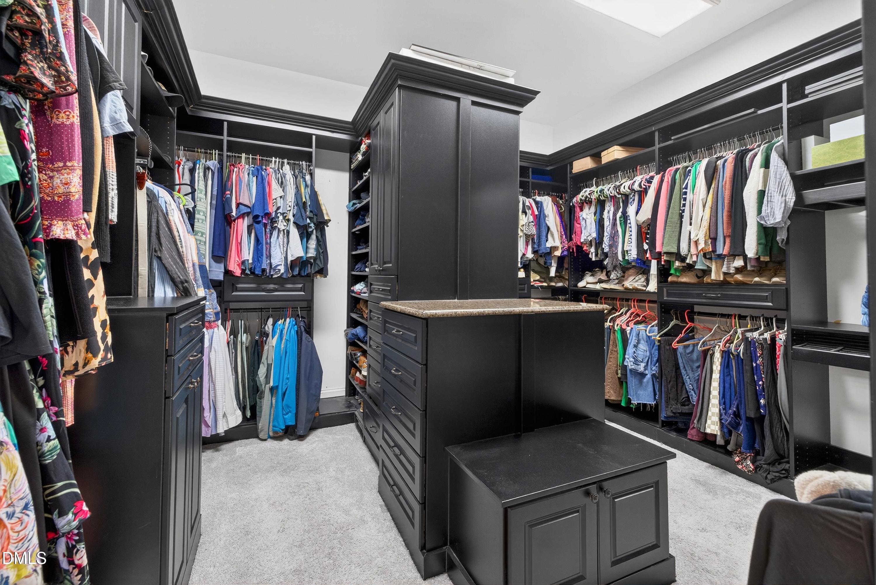 3513 Eilla Bluffs Court Raleigh, NC 27606 - Photo 37 of 86 a view of walk in closet with clothes and shoes