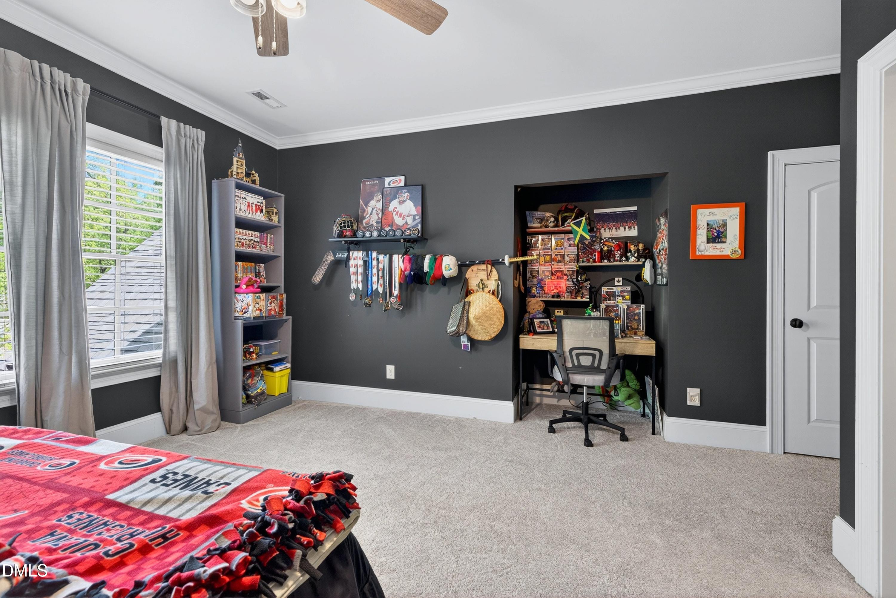 3513 Eilla Bluffs Court Raleigh, NC 27606 - Photo 48 of 86 a bedroom with a bed and a desk