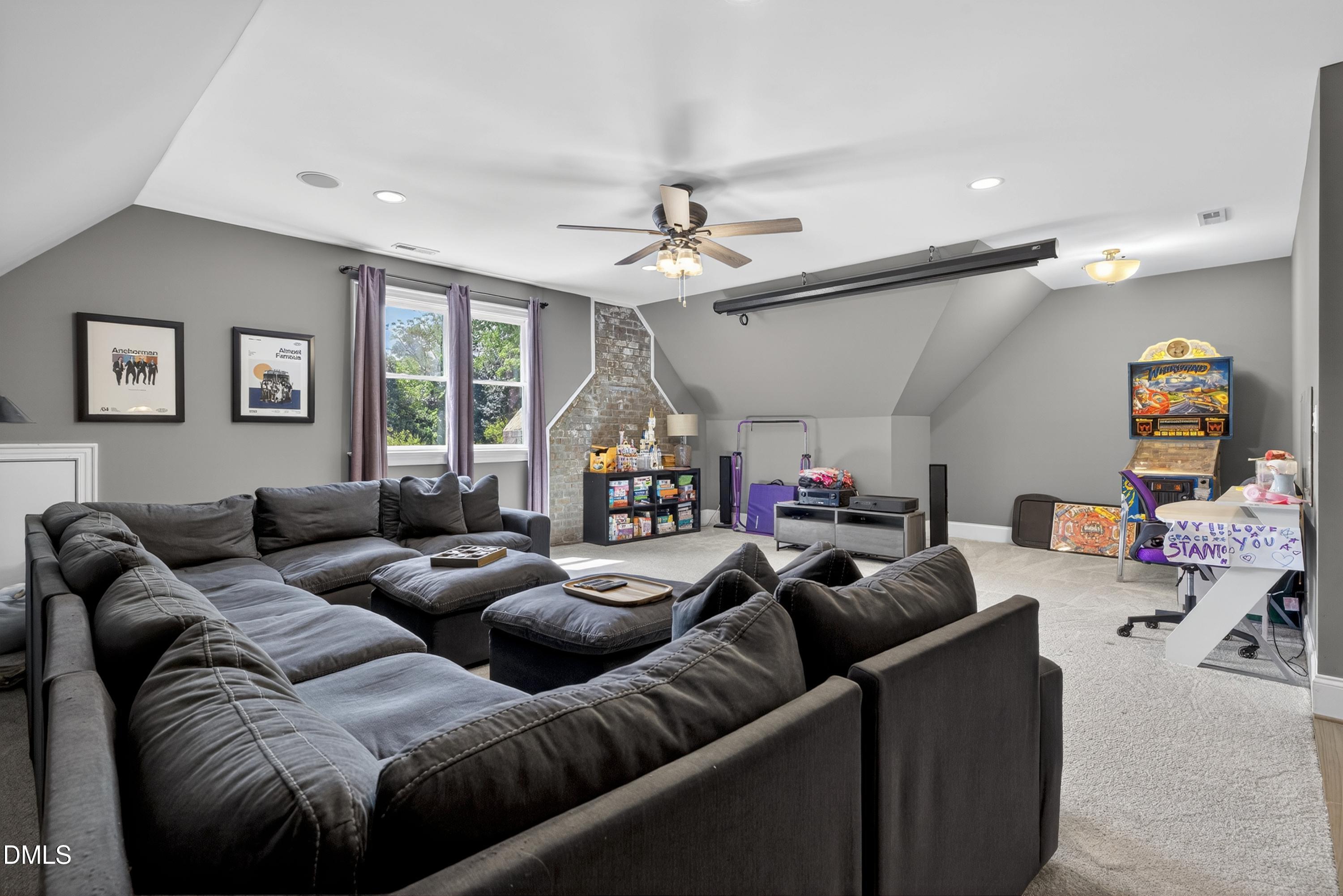 3513 Eilla Bluffs Court Raleigh, NC 27606 - Photo 58 of 86 a living room with furniture a ceiling fan and a window