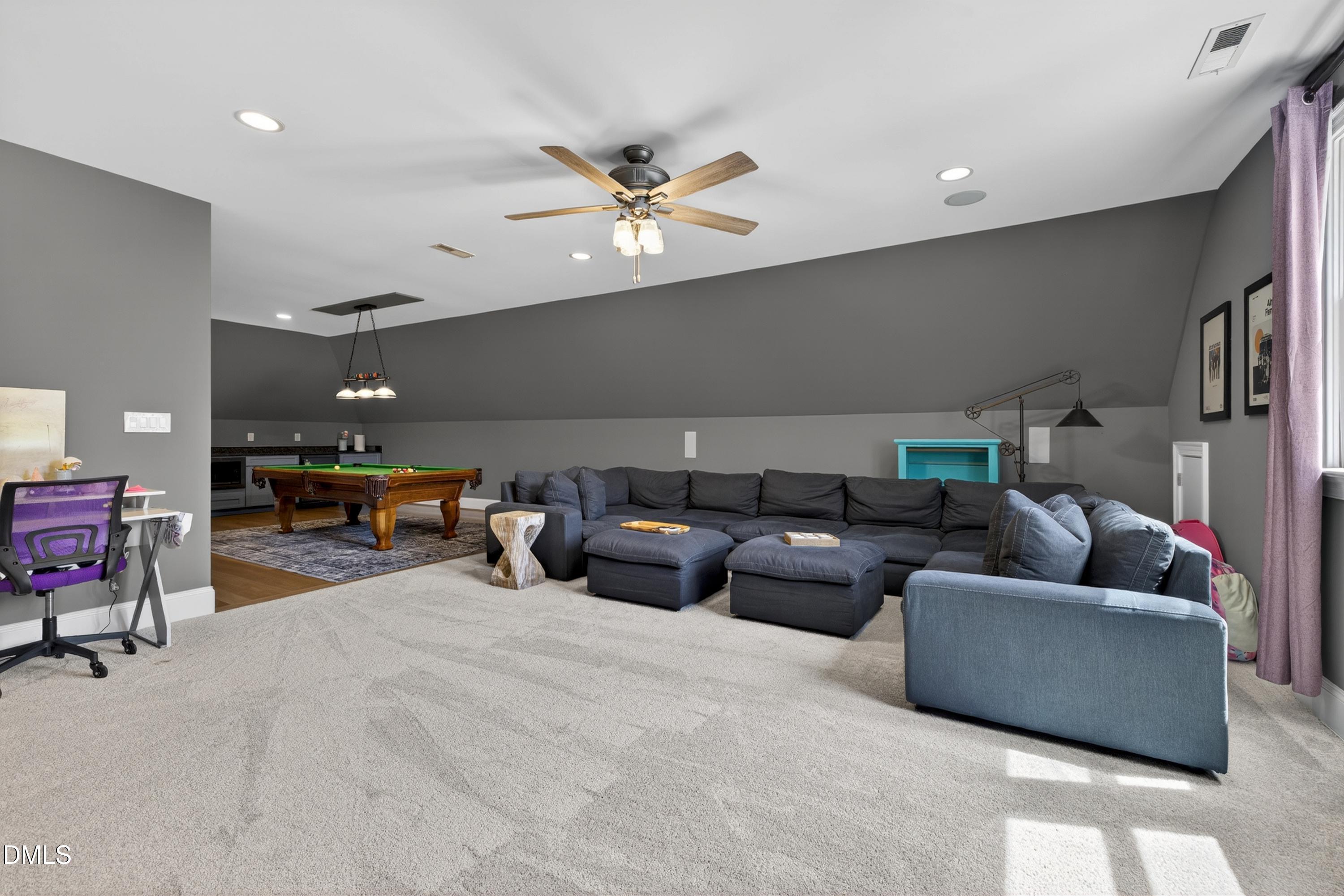 3513 Eilla Bluffs Court Raleigh, NC 27606 - Photo 59 of 86 a living room with furniture and a ceiling fan